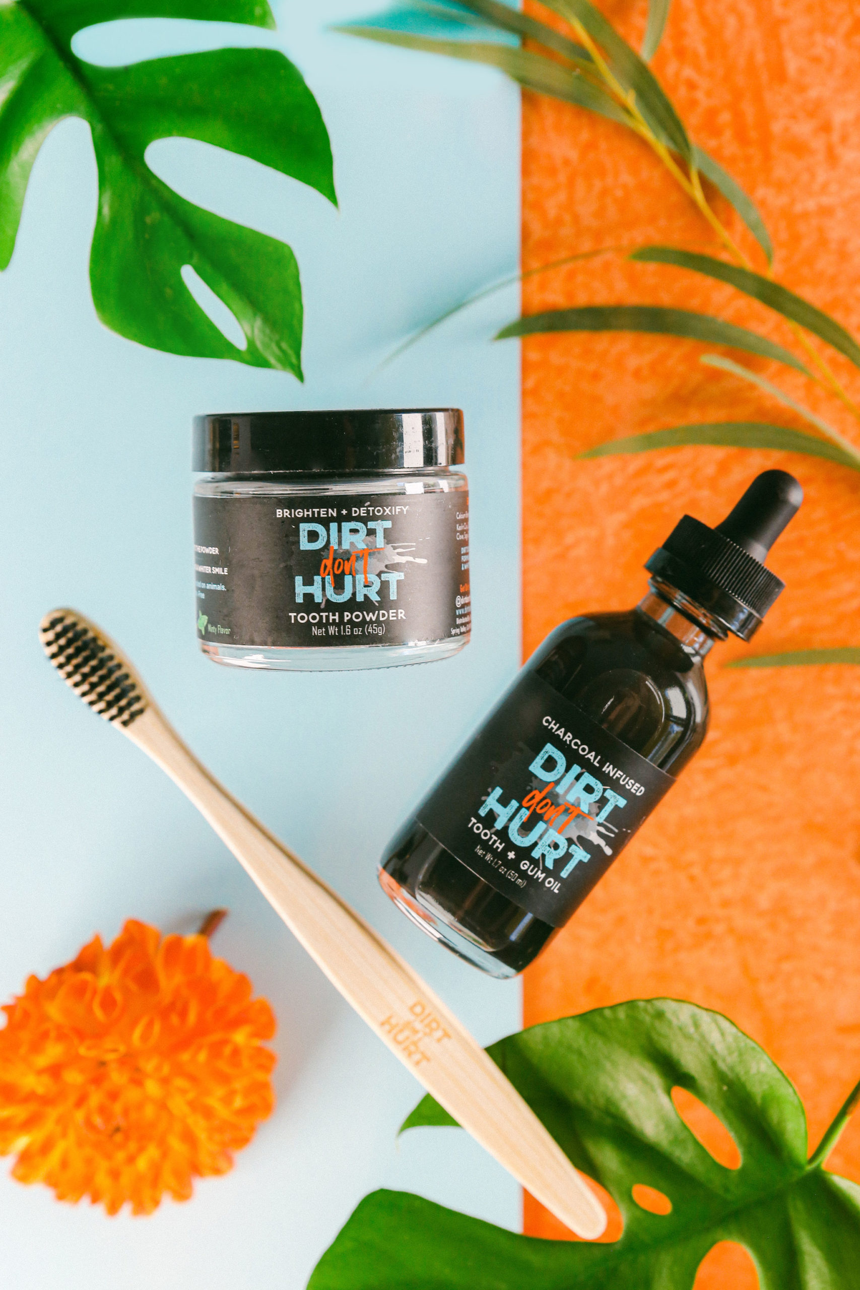 Styled funky tropical colorful flat lay charcoal natural toothpaste