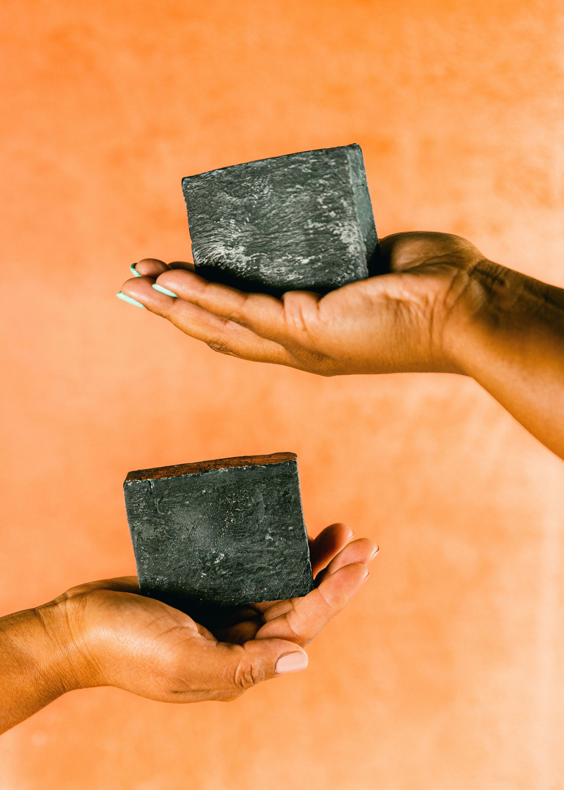 Styled skincare product photography charcoal body soap black owned small business