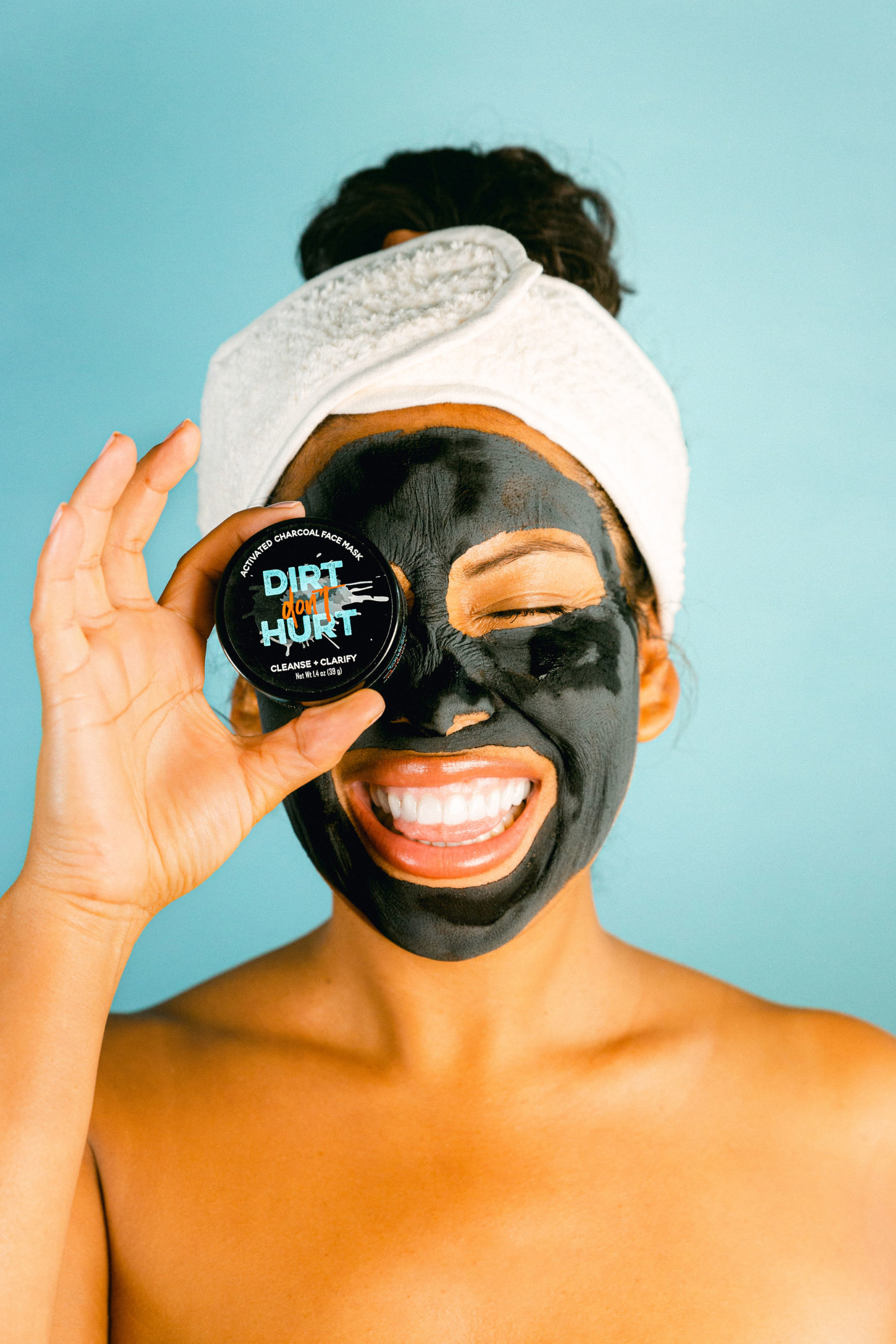 Skincare face mask product photography by Chelsea Loren black charcoal face mask with spa headband cute funky skincare