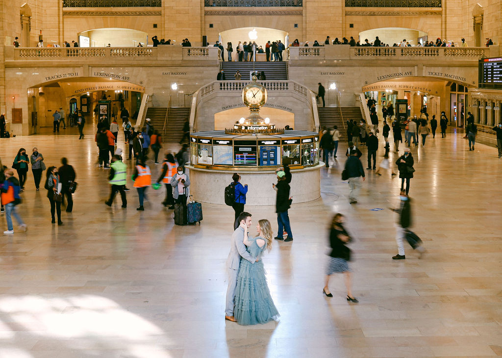 Grand Central Station engagement photoshoot inspired by Gossip Girl. Teal tulle vintage ruffle dress branding photographer Chelsea Loren.