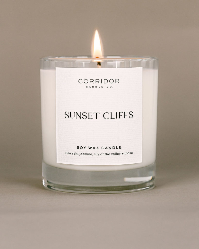 Minimal ecommerce product photography for handmade San Diego candles on a warm gray backdrop for a cozy feeling.