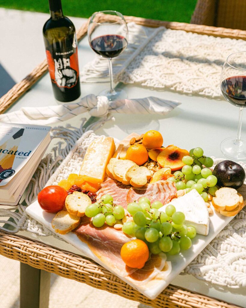 Real estate property manager investment aging like a fine wine with outdoor cheese charcuterie board personal brand photography by Chelsea Loren