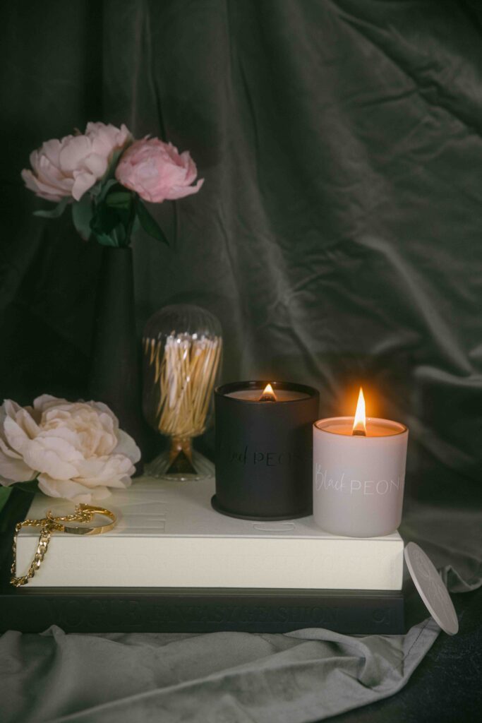 Luxurious styled bougie glamorous old money sophia richie styled product photography for candles vignette black peonies blair waldorf gossip girl new york city ritz