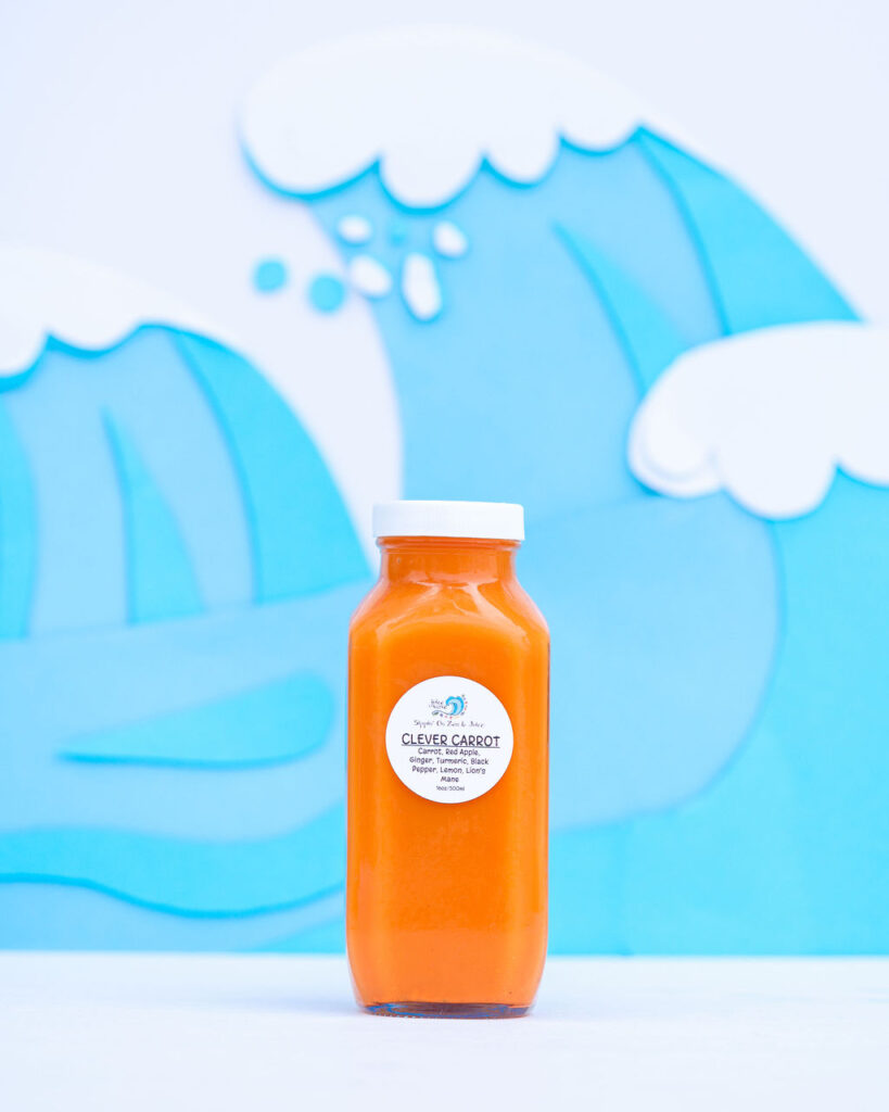 Colorful custom paper wave backdrop product photography for smoothie juice brand in San Diego