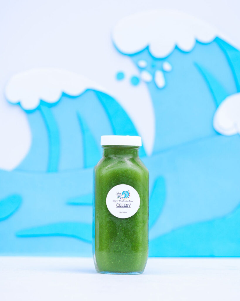 Colorful custom paper wave backdrop product photography for smoothie juice brand in San Diego