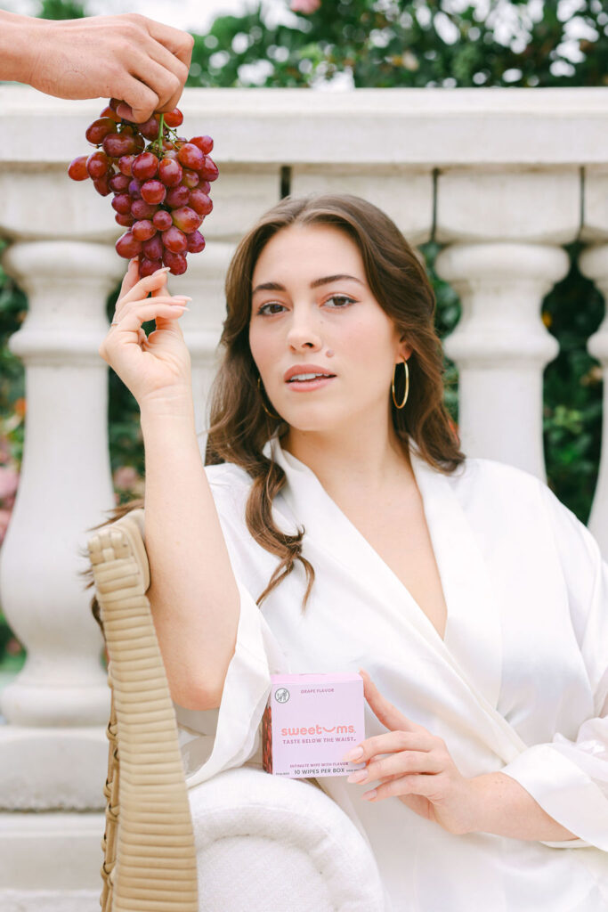 Creative brand photography in Southern California girl eating grapes greek goddess creative direction outdoors getty villa model laurel witt