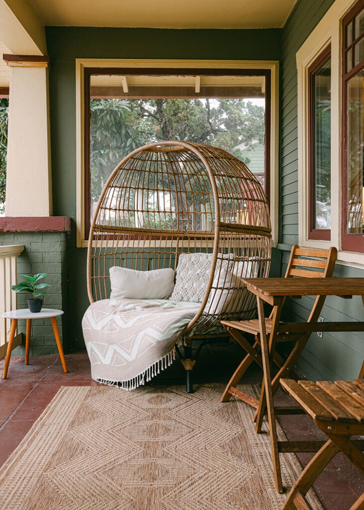 peacock chair on porch craftsman house