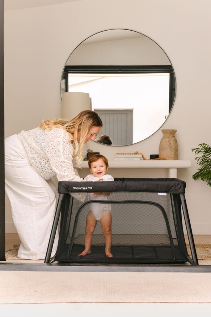 baby playing in travel crib with side zipper luxury commercial kids lifestyle photography
