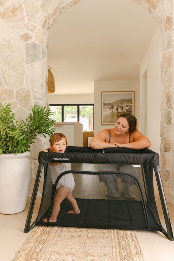 baby playing in travel crib with side zipper luxury commercial kids lifestyle photography