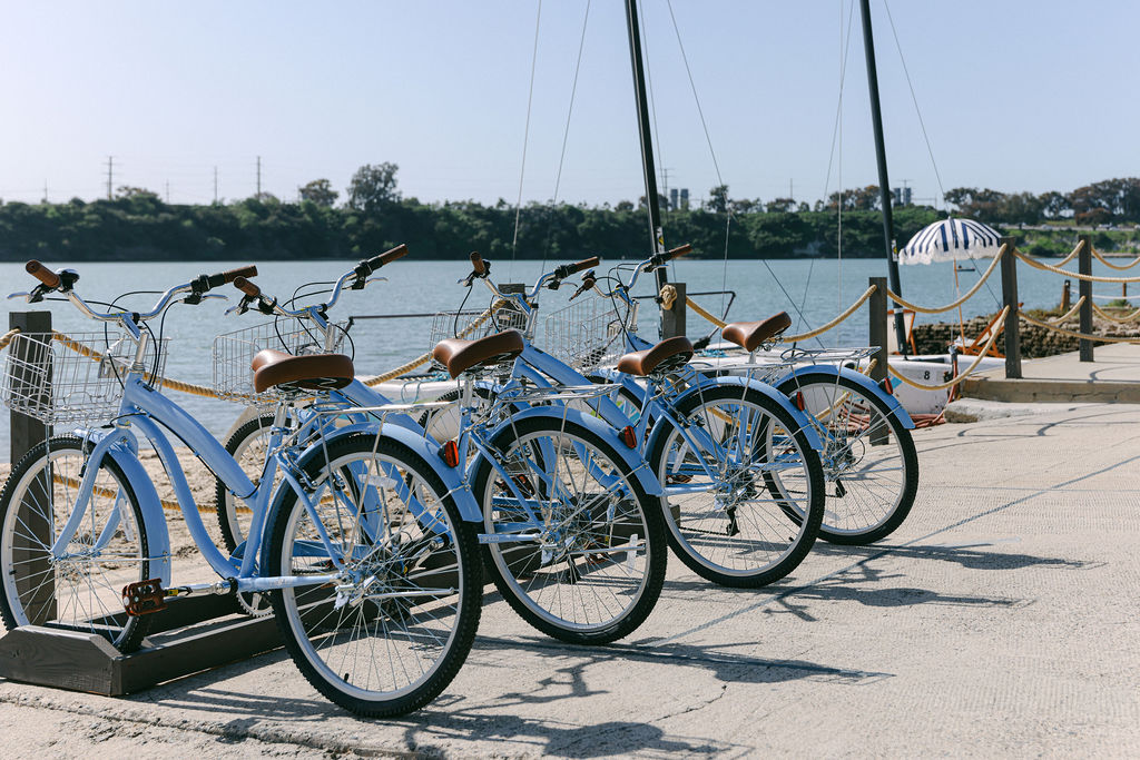 Blue beach cruiser bicycles available at a luxury Airbnb on the Carlsbad Lagoon in Southern California, photographed by Chelsea Loren