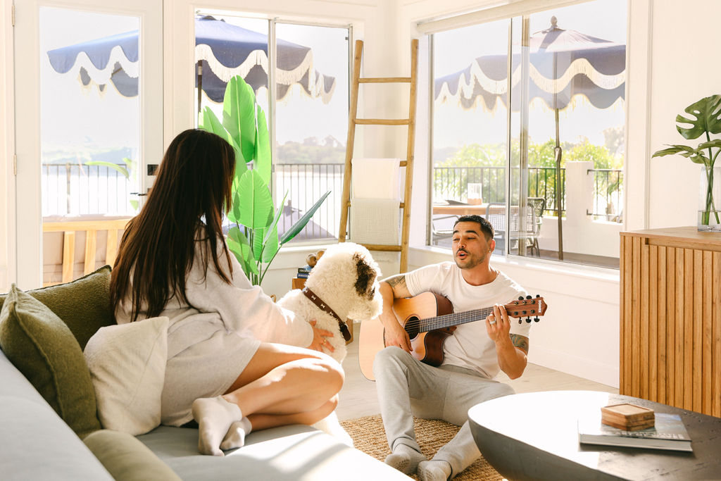 Outdoor hot tub with tropical landscaping and lounge chairs at a luxury Carlsbad Airbnb, resort-style amenity photography by Chelsea Loren