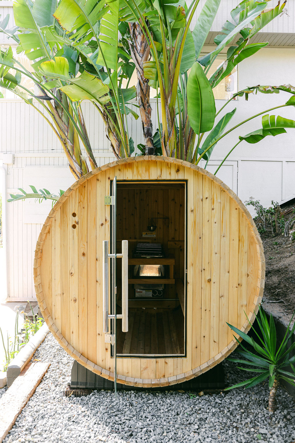 Couple clinking drinks in the back of a pickup truck on the Carlsbad lagoon shoreline, editorial lifestyle photography by Chelsea Loren