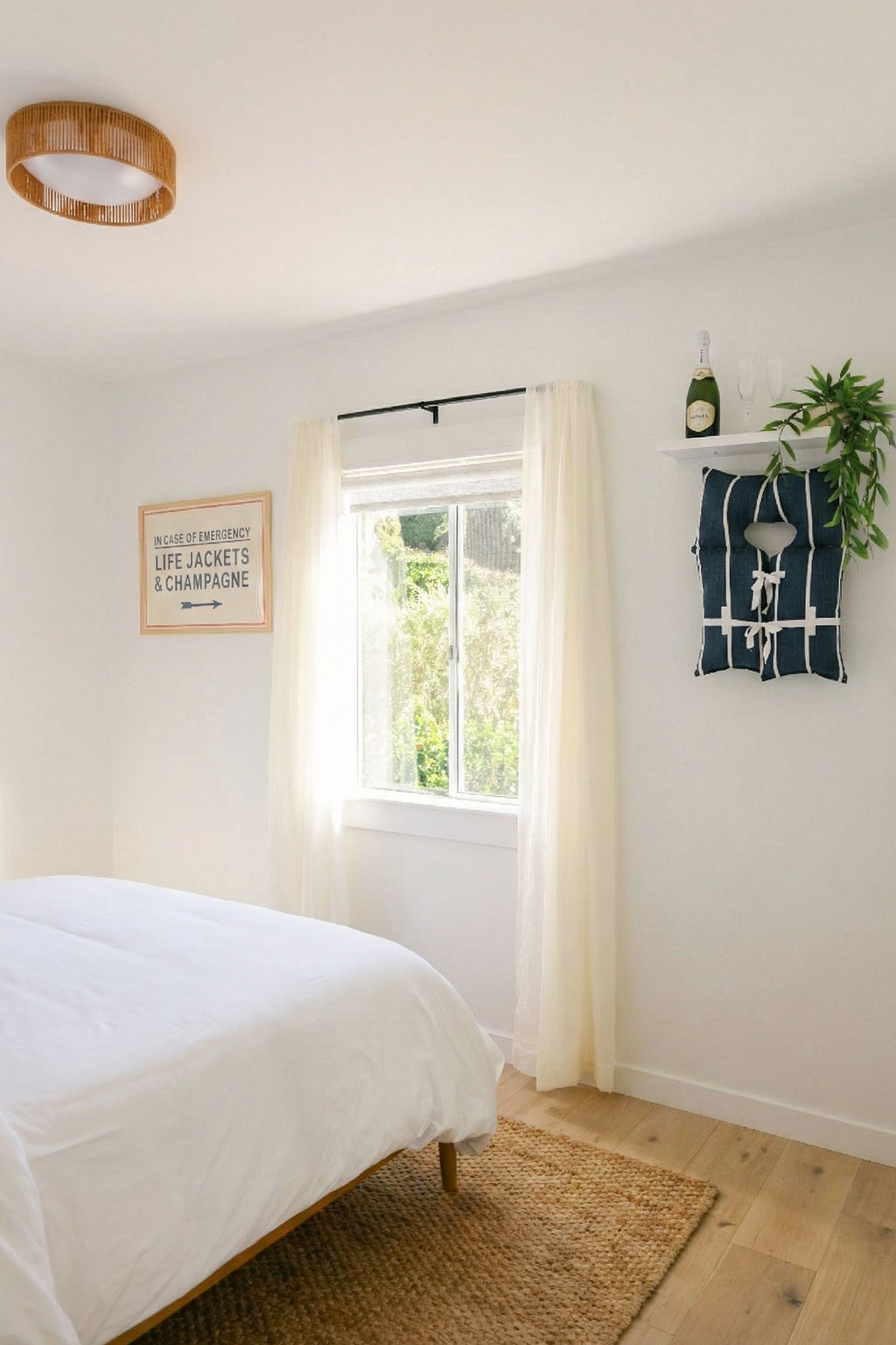 Luxury Airbnb bedroom interior photography in Carlsbad, California, elevated coastal decor with rattan lighting, champagne details, and personality-driven styling by Chelsea Loren