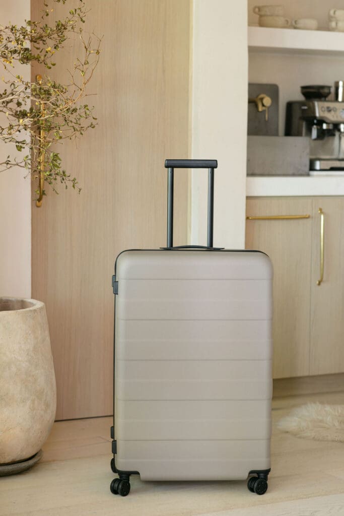 MUJI SS26 hard-shell luggage in slate grey – product lifestyle photography by Chelsea Loren, Carlsbad California brand shoot