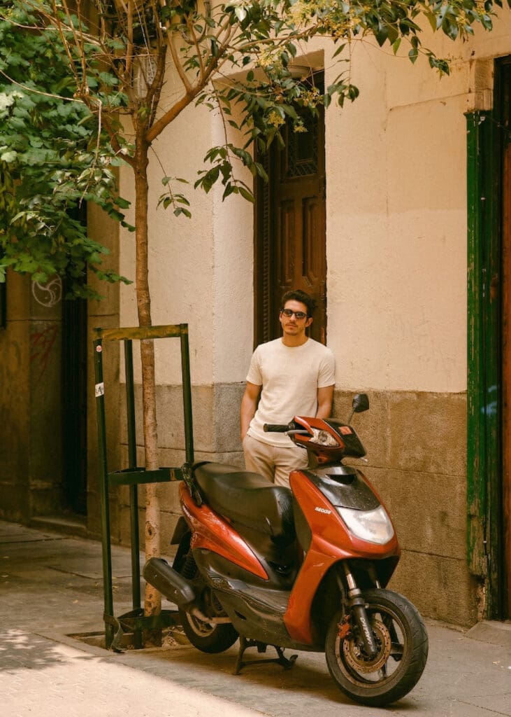 Mens fashion lookbook photography of model with scooter in architectural California setting | Chelsea Loren Creative Director Photographer