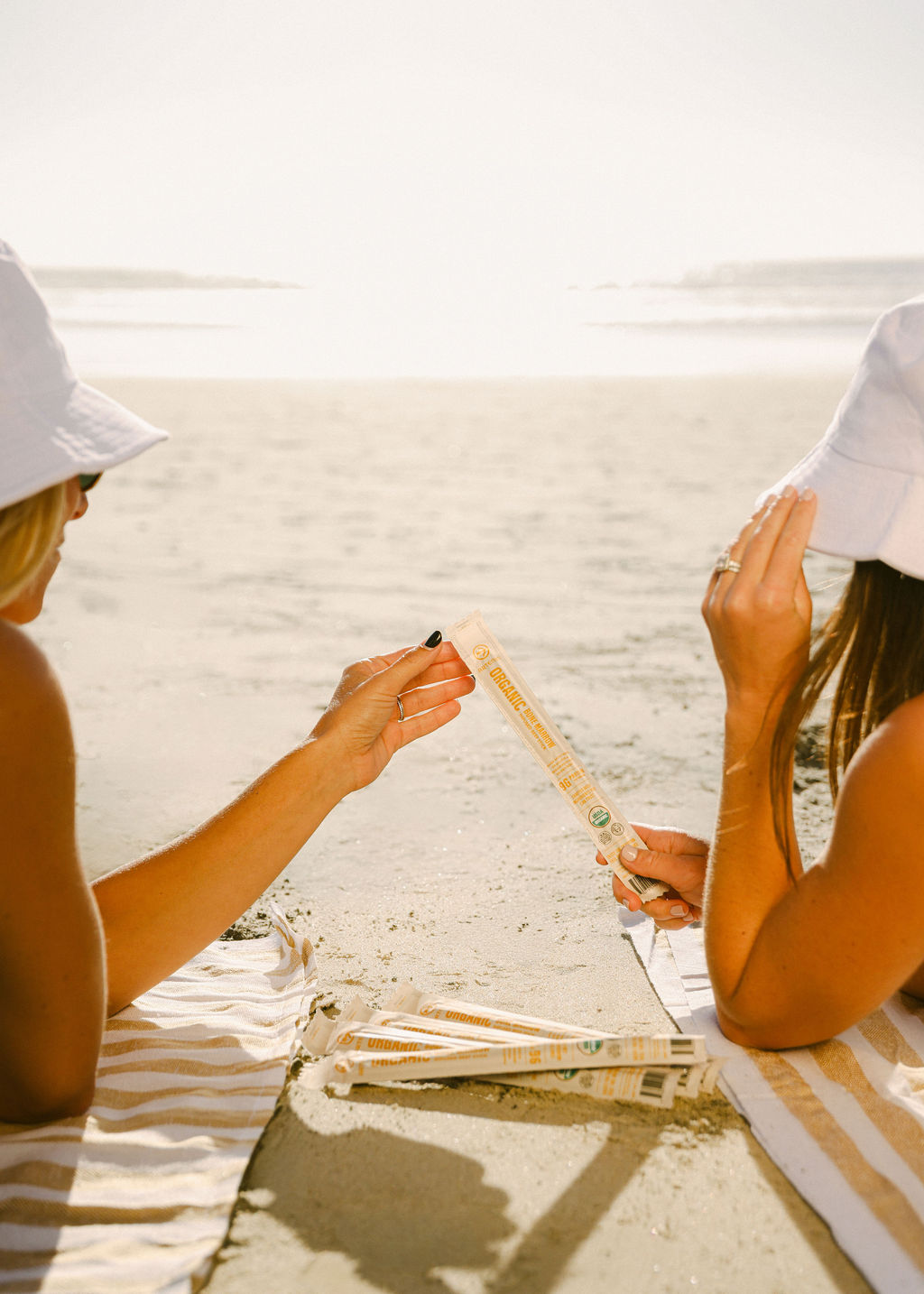 styled beach blanket setup with CPG food products and props for lifestyle brand photography production