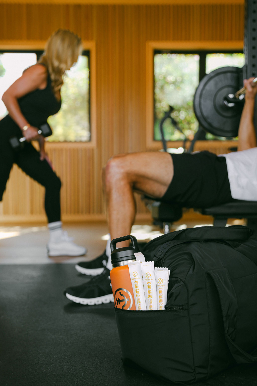 fitness lifestyle photography for CPG food brand showing model working out in home gym