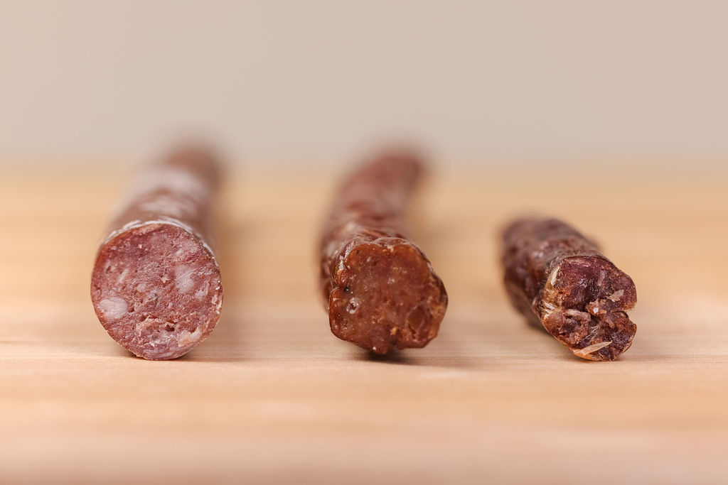 artisan beef stick product photography showing texture and quality for CPG food brand