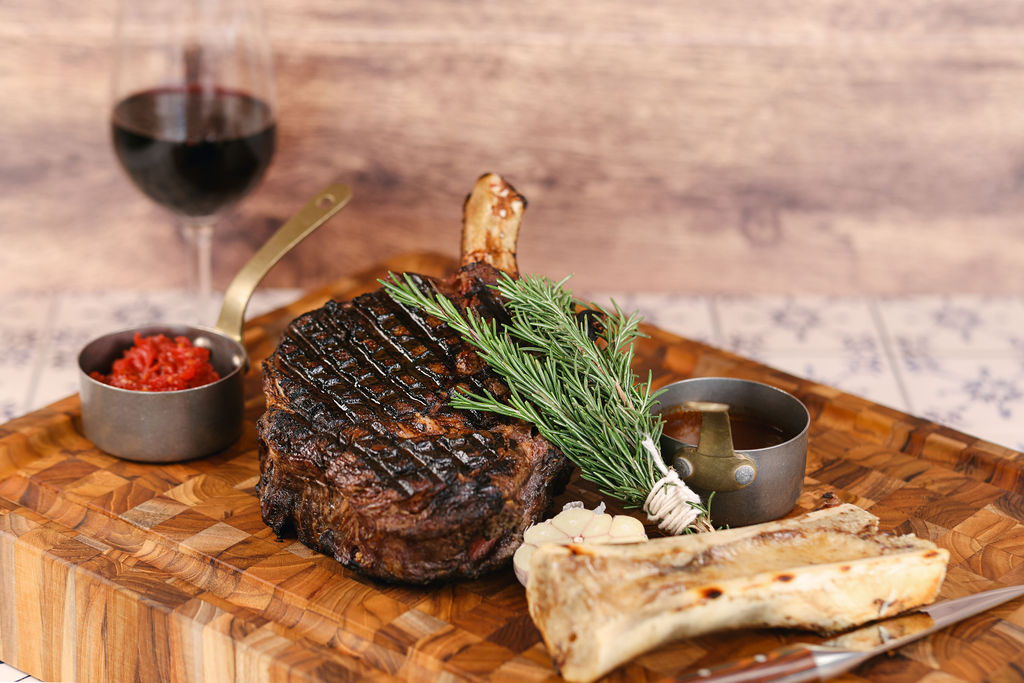 Styled dry-aged cowboy ribeye steak food photography for luxury hotel restaurant at Gaylord Pacific Resort in Chula Vista California by Chelsea Loren