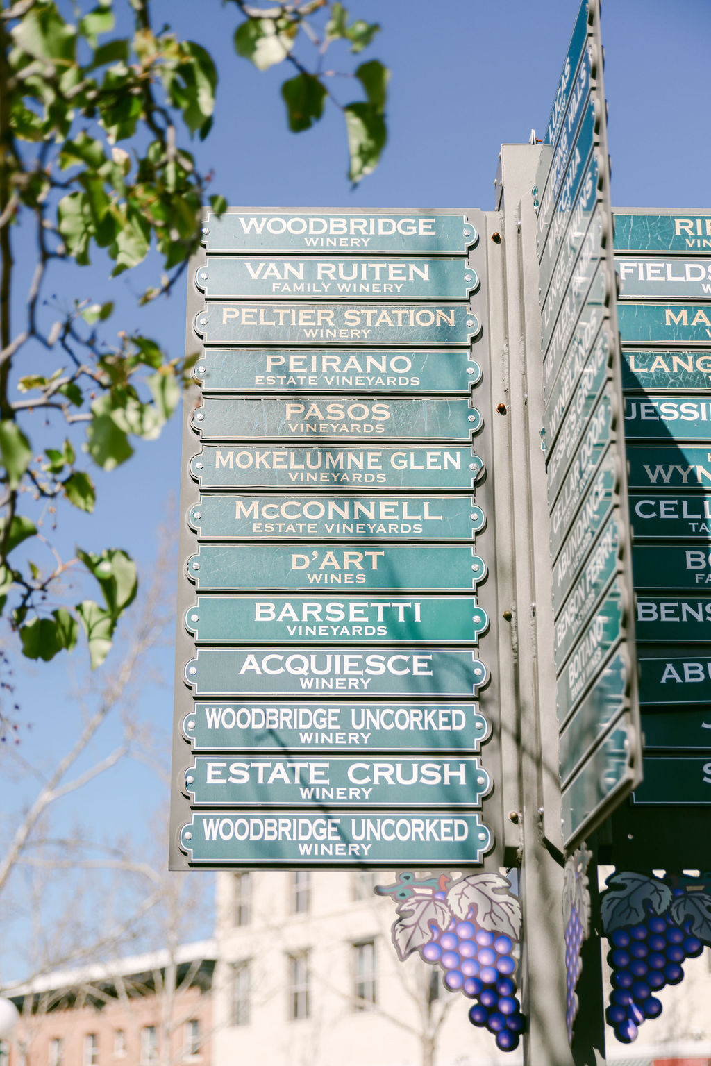 BBQ burger held up against Lodi Beer Company colorful vintage lager mural wall