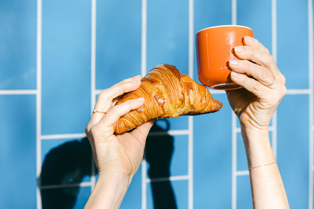 Lodi wine country directional sign with winery names stacked against a blue sky