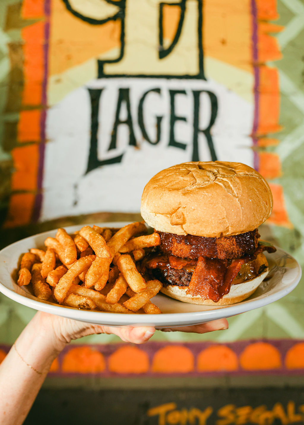Dessert plate with crème brûlée and candied nuts alongside glass of red wine at Zin Bistro Lodi